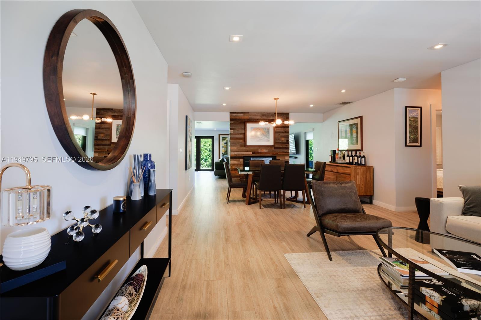 6201 Southwest 36th Street Miami, FL 33155 - Photo 17 of 43 a living room with furniture and a mirror