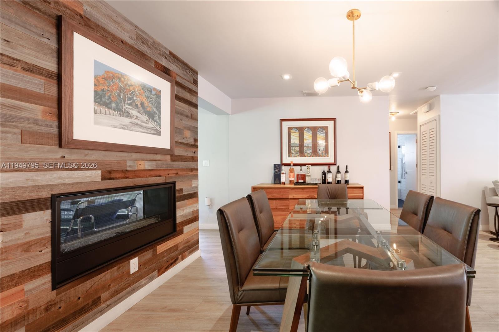 6201 Southwest 36th Street Miami, FL 33155 - Photo 22 of 43 a view of a dining room with furniture a fireplace and wooden floor