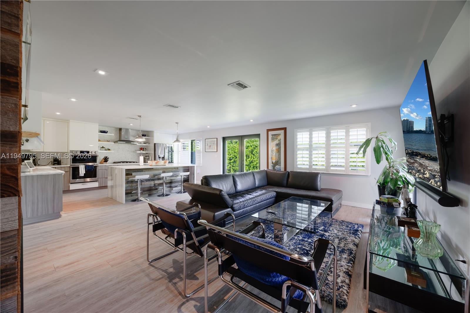 6201 Southwest 36th Street Miami, FL 33155 - Photo 23 of 43 a living room with furniture fireplace and a flat screen tv