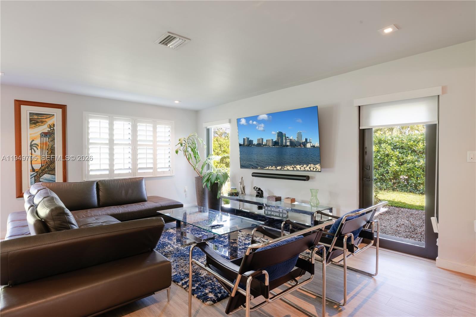 6201 Southwest 36th Street Miami, FL 33155 - Photo 24 of 43 a living room with furniture and a flat screen tv