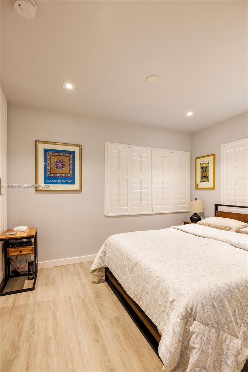 6201 Southwest 36th Street Miami, FL 33155 - Photo 32 of 43 a bedroom with a large bed and a window