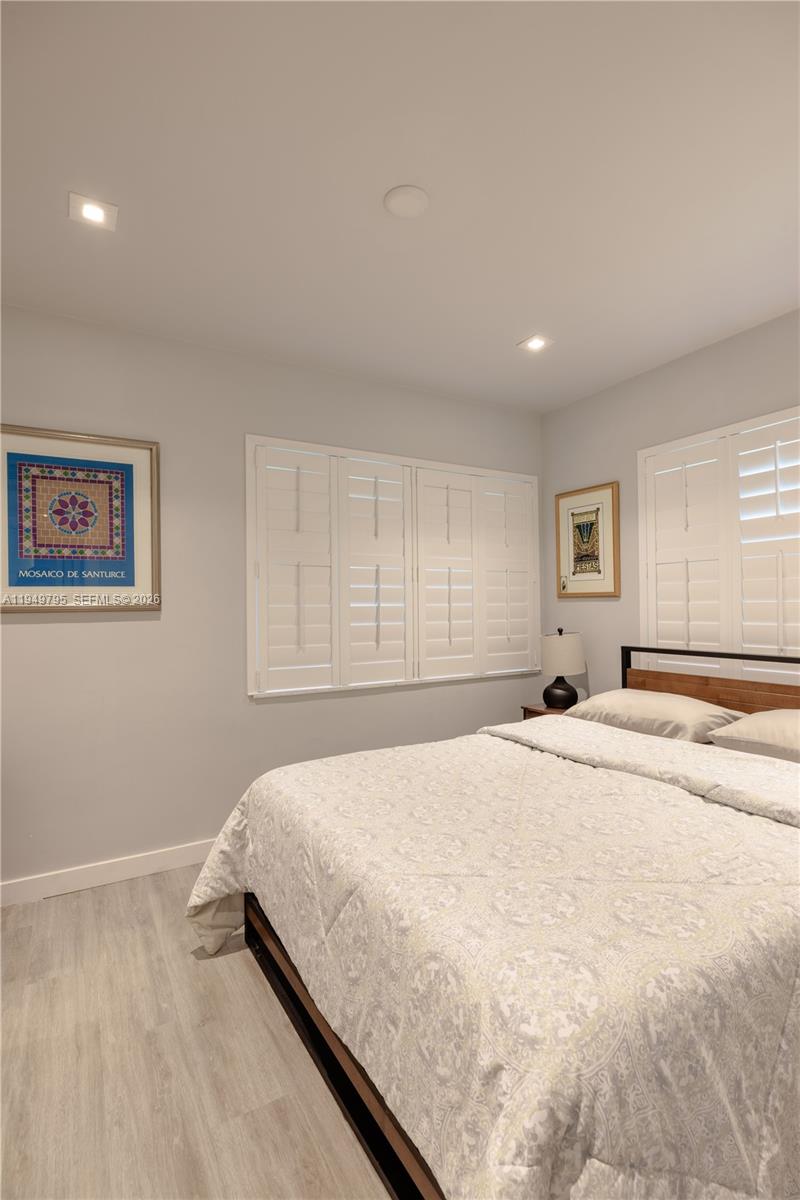 6201 Southwest 36th Street Miami, FL 33155 - Photo 33 of 43 a spacious bedroom with a bed and a window