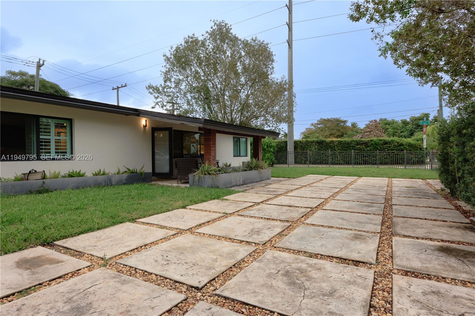 6201 Southwest 36th Street Miami, FL 33155 - Photo 40 of 43 a backyard of a house with lots of green space