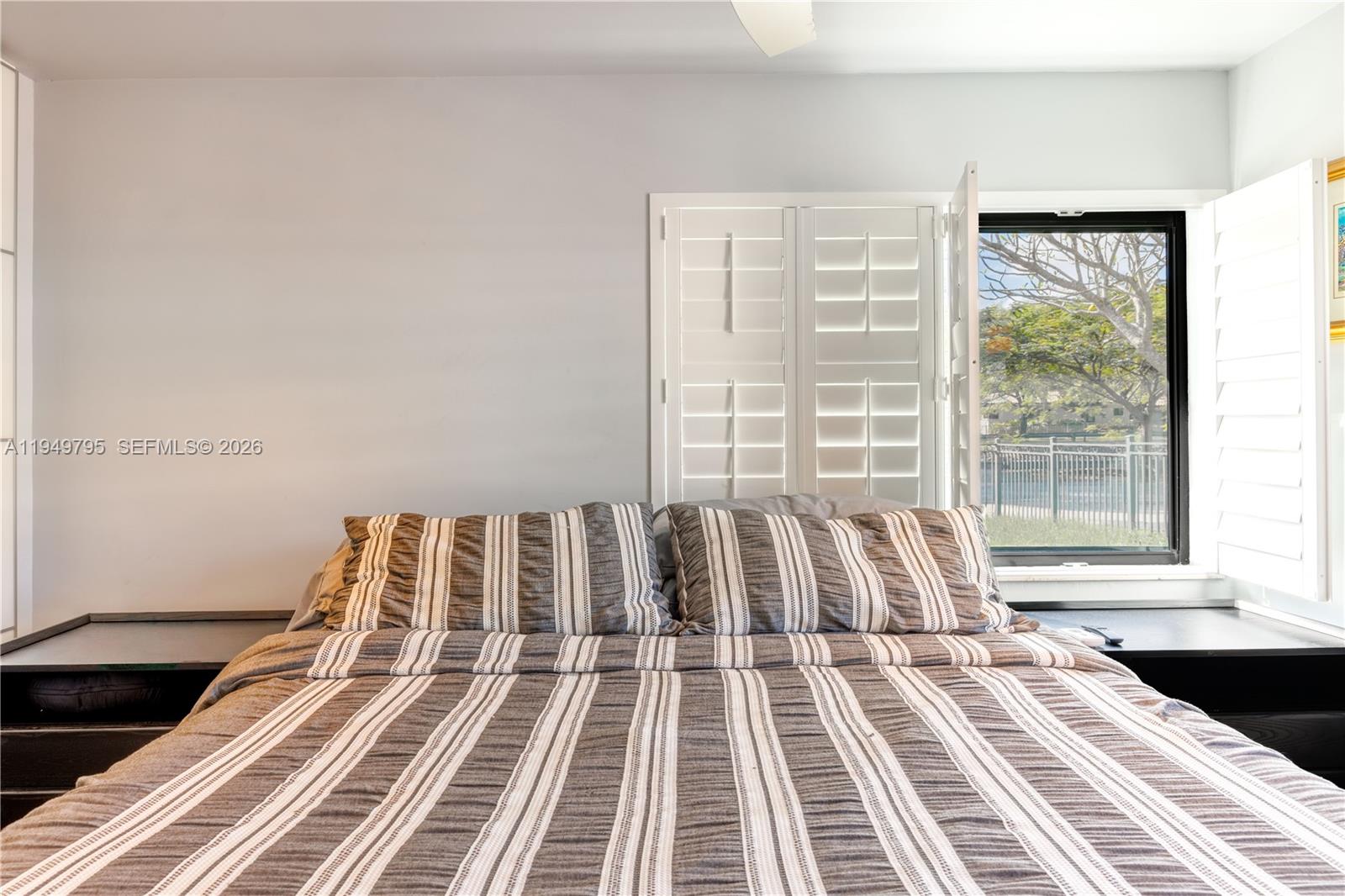 6201 Southwest 36th Street Miami, FL 33155 - Photo 7 of 43 a bed sitting in a bedroom next to a window