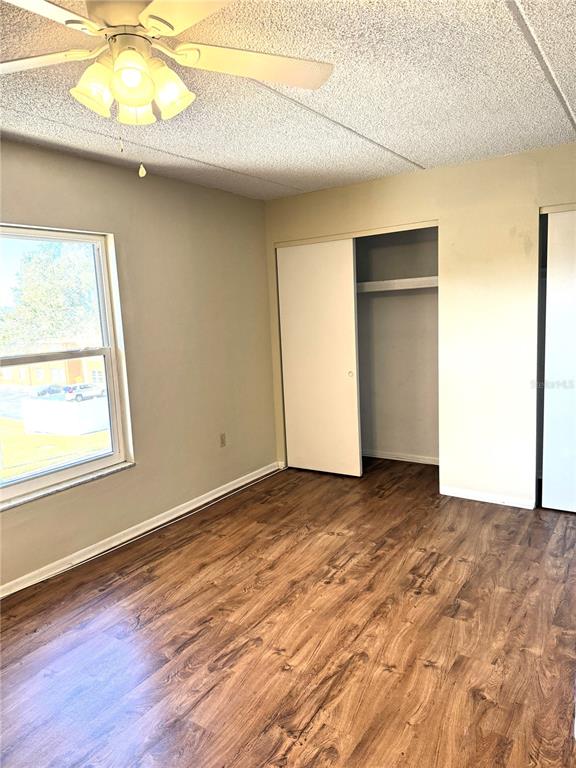 12760 Indian Rocks Road, Unit 562 Largo, FL 33774 - Photo 11 of 22 an empty room with a window and wooden floor