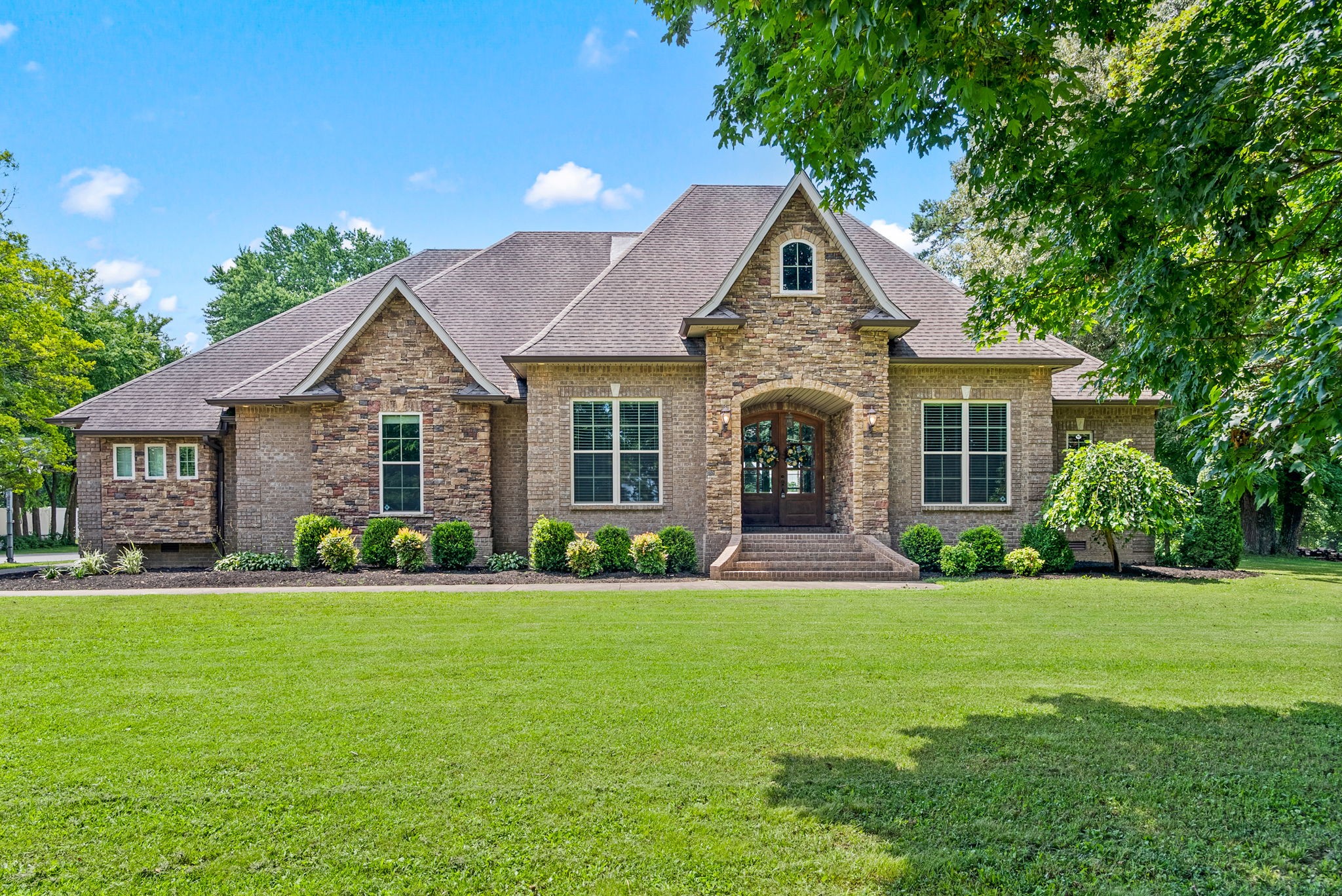 2976 Rossview Road Clarksville, TN 37043 - Photo 1 of 54 a front view of a house with a yard and garage