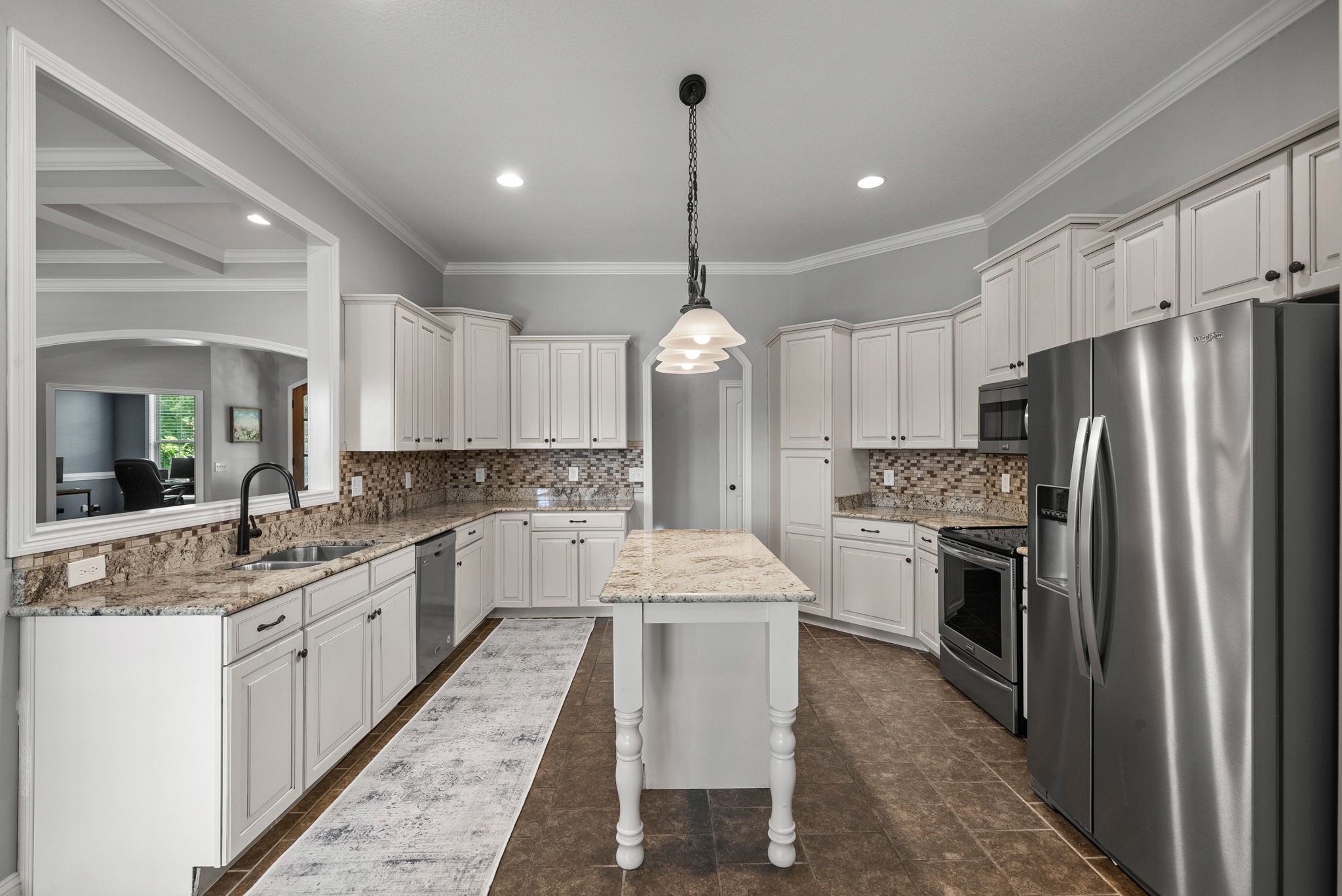 2976 Rossview Road Clarksville, TN 37043 - Photo 14 of 54 a large kitchen with kitchen island a sink stainless steel appliances and cabinets