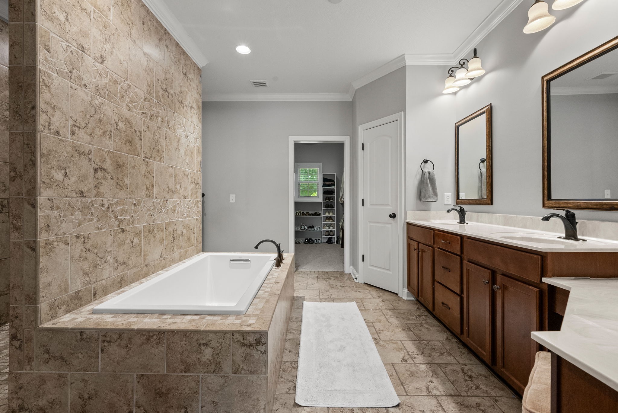 2976 Rossview Road Clarksville, TN 37043 - Photo 26 of 54 a spacious bathroom with a tub sink and mirror