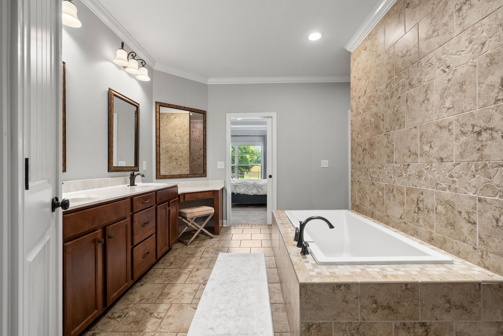 2976 Rossview Road Clarksville, TN 37043 - Photo 27 of 54 a spacious bathroom with a granite countertop tub sink and mirror