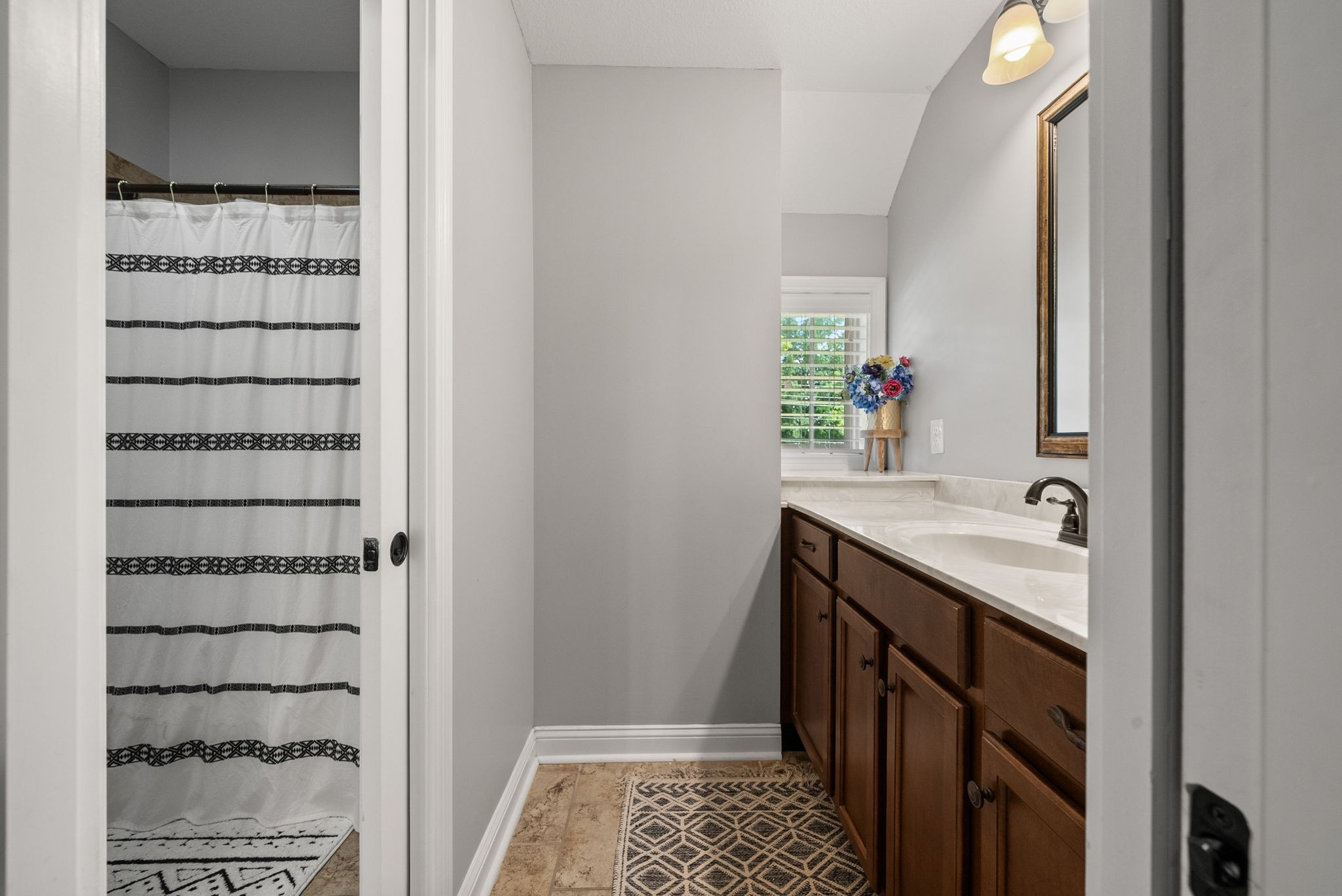 2976 Rossview Road Clarksville, TN 37043 - Photo 31 of 54 a bathroom with a sink and a mirror