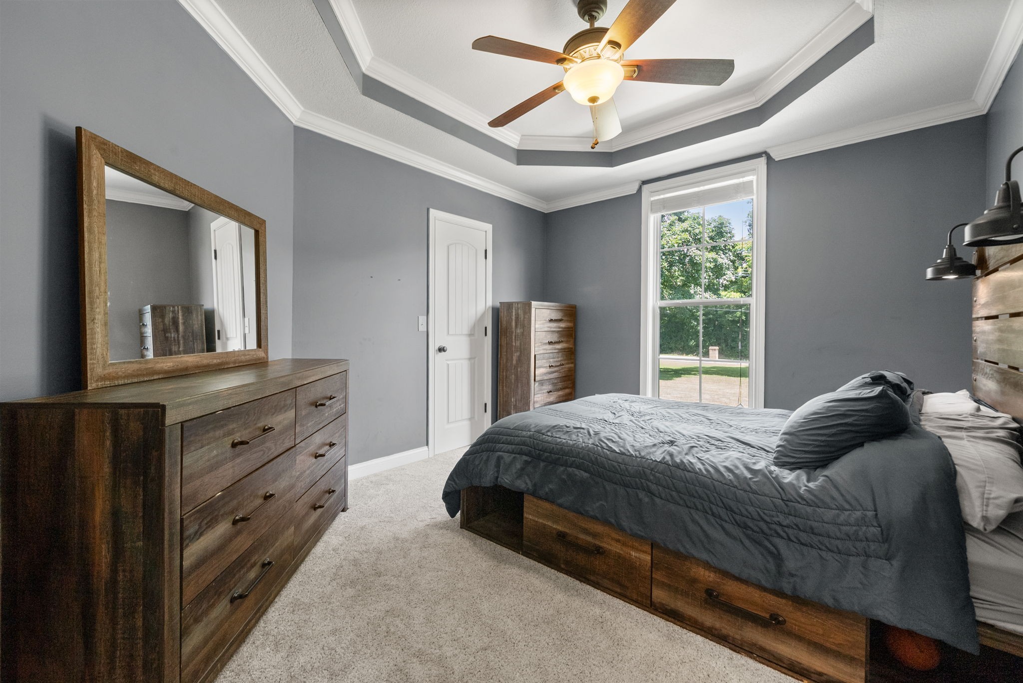 2976 Rossview Road Clarksville, TN 37043 - Photo 34 of 54 a bedroom with a large bed and a large mirror on the dresser