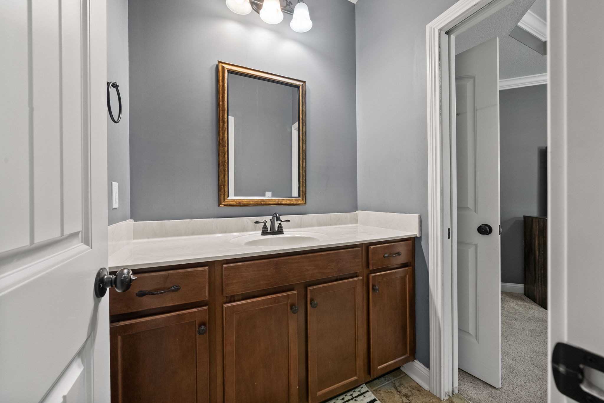 2976 Rossview Road Clarksville, TN 37043 - Photo 36 of 54 a bathroom with a double vanity sink and mirror