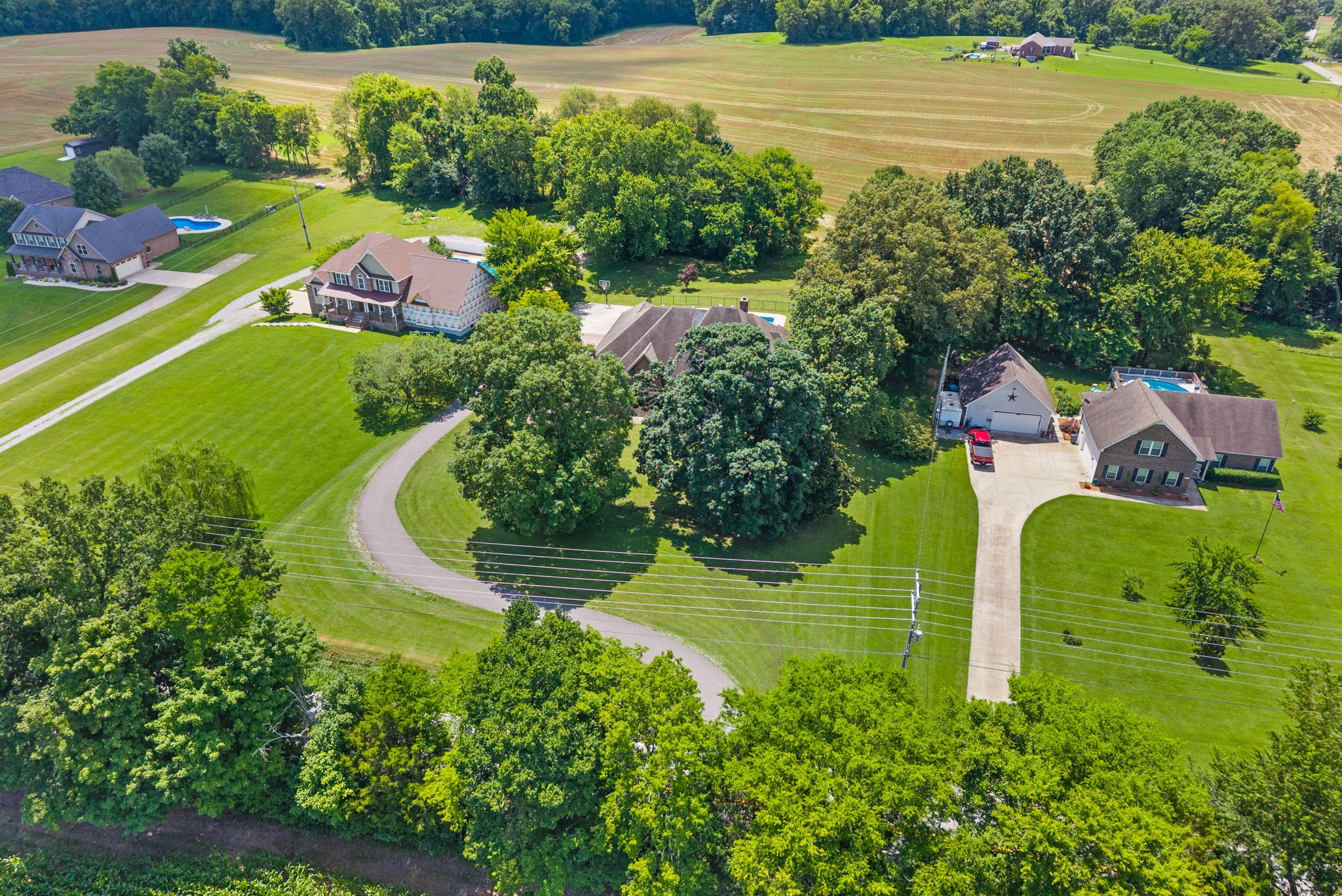 2976 Rossview Road Clarksville, TN 37043 - Photo 49 of 54 an aerial view of a house with outdoor space swimming pool patio and lake view