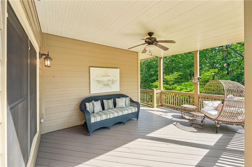 189 Red Trillium Ridge Big Canoe, GA 30143 - Photo 69 of 98 a living room with furniture and a floor to ceiling window