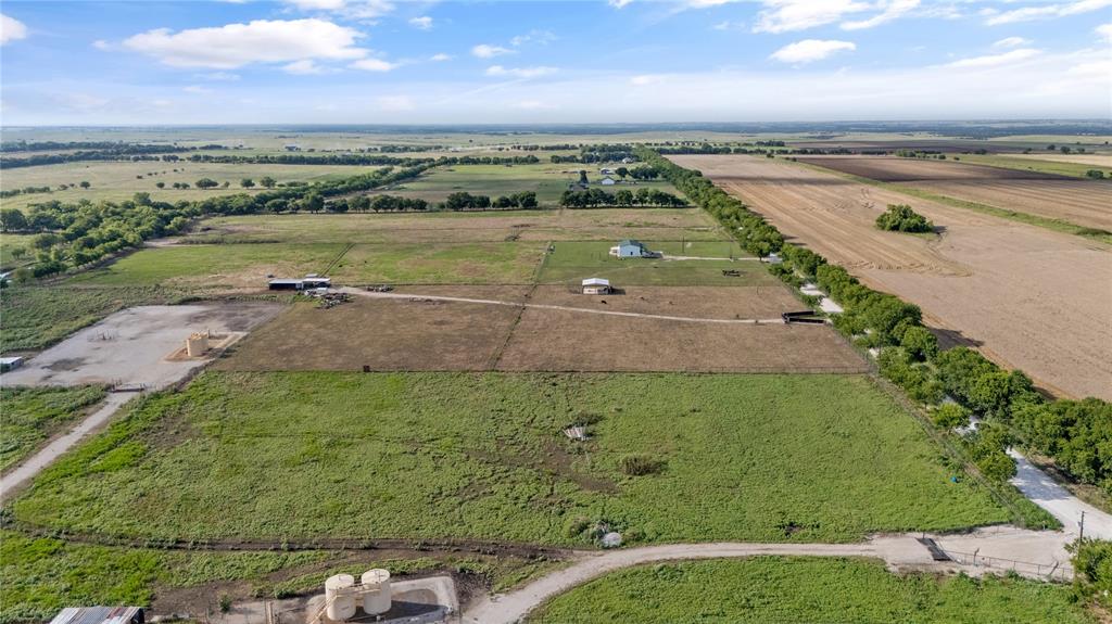 9725 Atcheson Road Decatur, TX 76234 - Photo 6 of 7 Aerial view of property's location with rural landscape and rows of crops