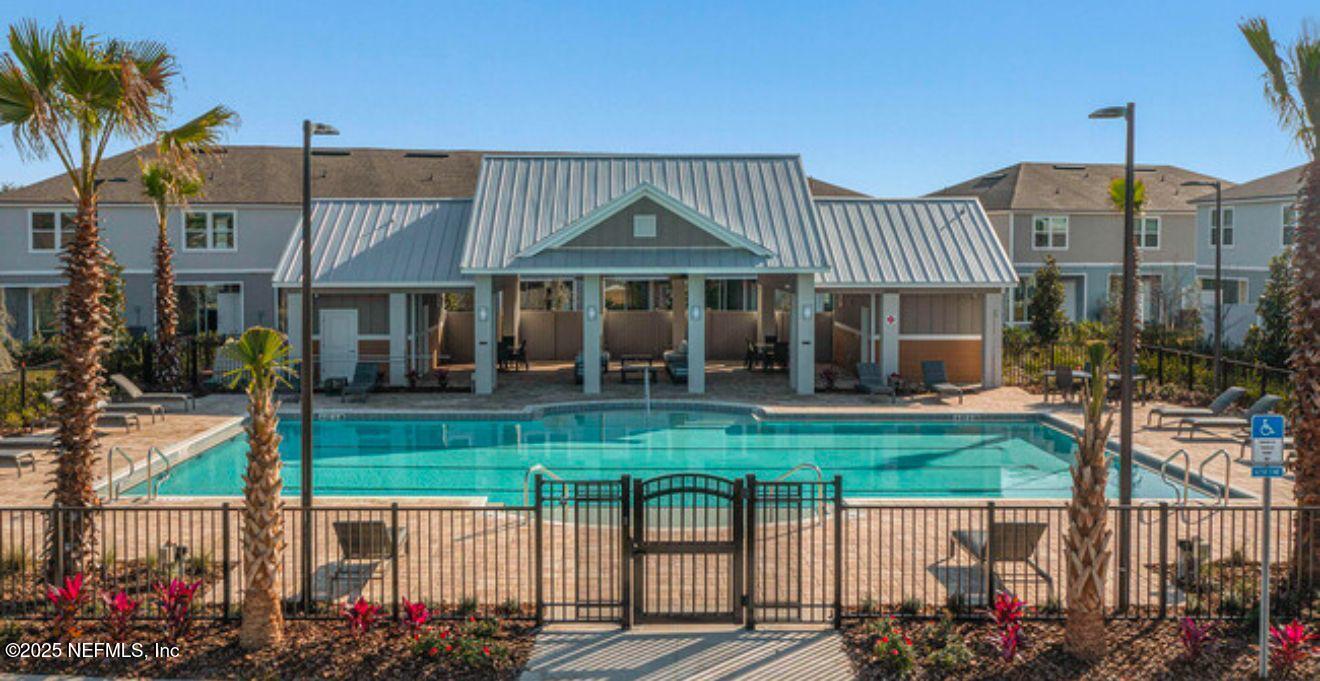8368 Retrograde Road Jacksonville, FL 32256 - Photo 13 of 16 a view of a house with a porch and a garden