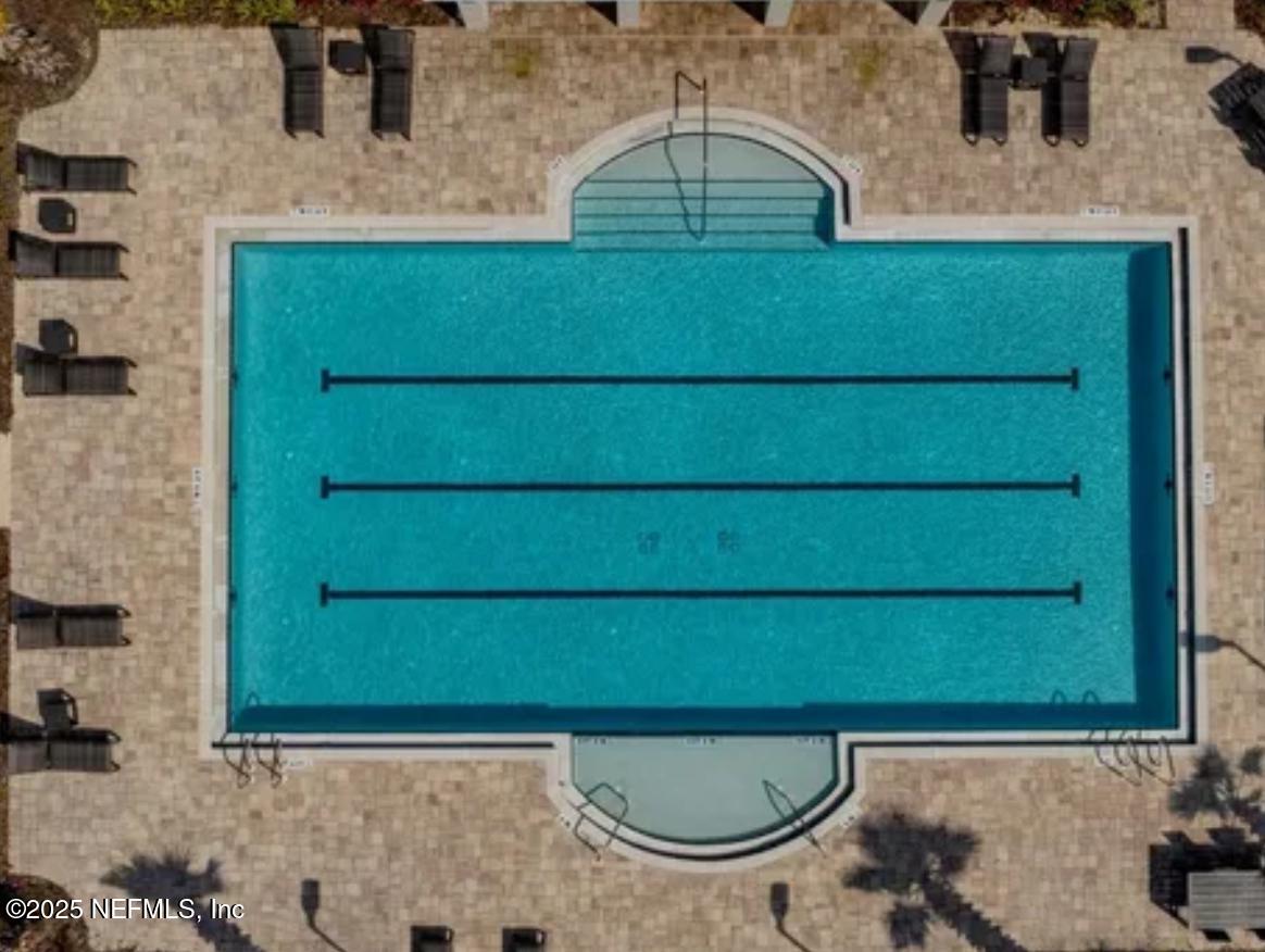 8368 Retrograde Road Jacksonville, FL 32256 - Photo 15 of 16 a bathroom with a sink and a mirror