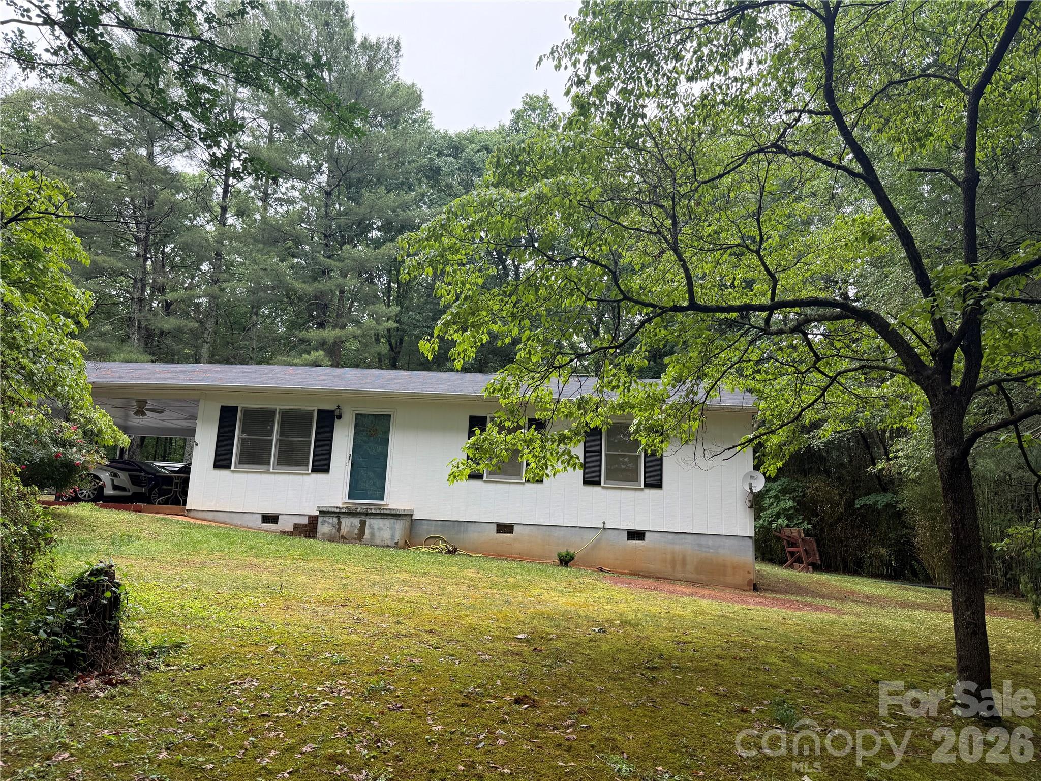 580 Legion Road Lenoir, NC 28645 - Photo 17 of 22 a front view of house with yard and trees