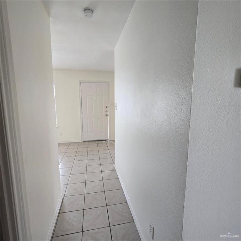 3915 South Alamo Road, Unit 10 Edinburg, TX 78542 - Photo 6 of 9 Hallway with light tile patterned floors