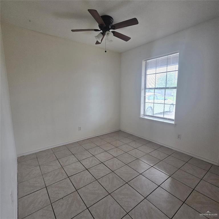 3915 South Alamo Road, Unit 10 Edinburg, TX 78542 - Photo 8 of 9 Unfurnished room with ceiling fan