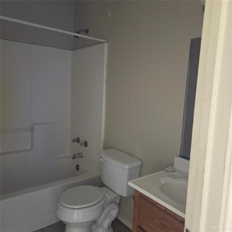 3915 South Alamo Road, Unit 10 Edinburg, TX 78542 - Photo 9 of 9 Full bathroom featuring vanity, shower combination, and toilet