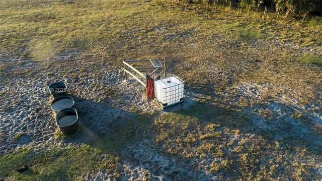 a view of a lake with houses in the back