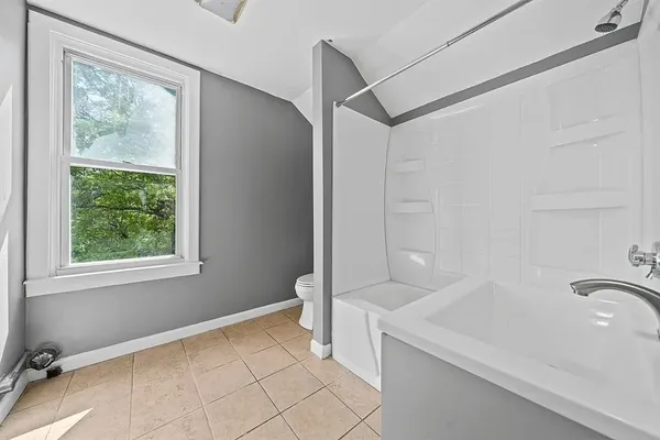 a bathroom with a sink and a shower