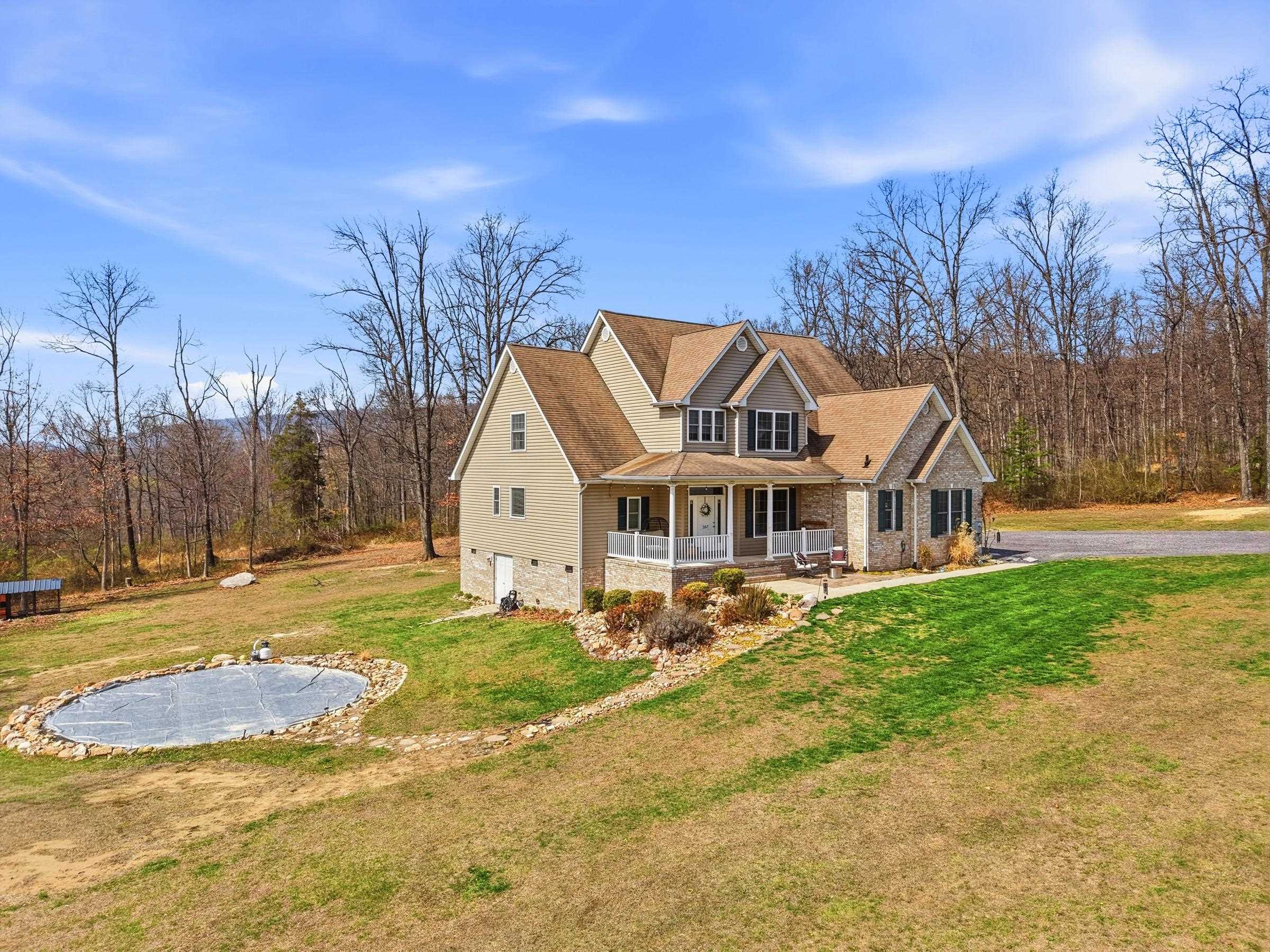 257 Hunter Road Maurertown, VA 22644 - Photo 58 of 61 a view of a white house with a big yard and large trees