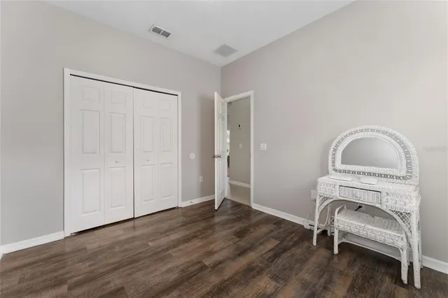 a view of a livingroom with furniture and wooden floor