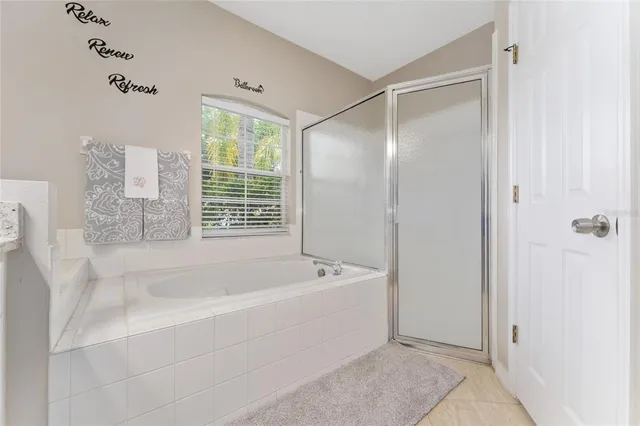 a bathroom with a bathtub and shower
