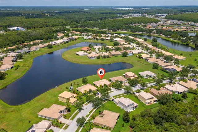 an aerial view of a residential houses with outdoor space