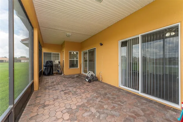 a view of a porch with wooden floor and outdoor space