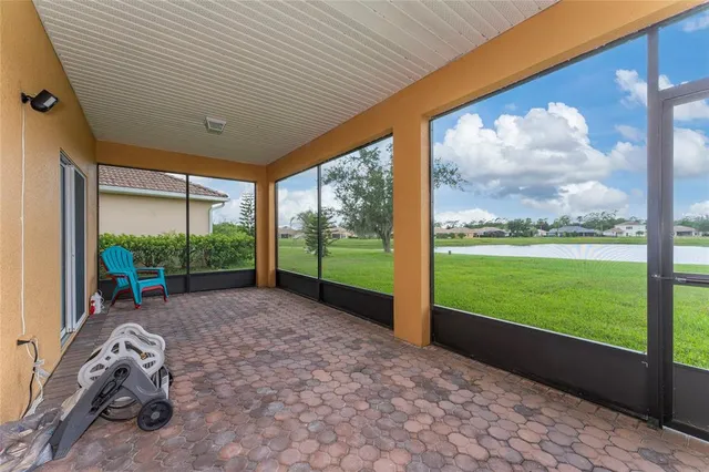 a view of a room with porch and wooden floor