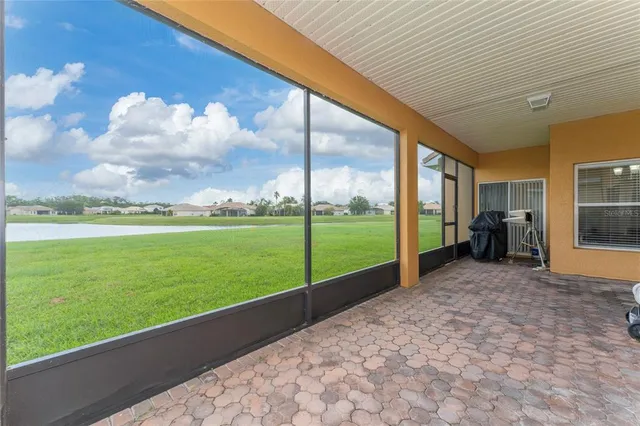 a view of a garden with an outdoor seating