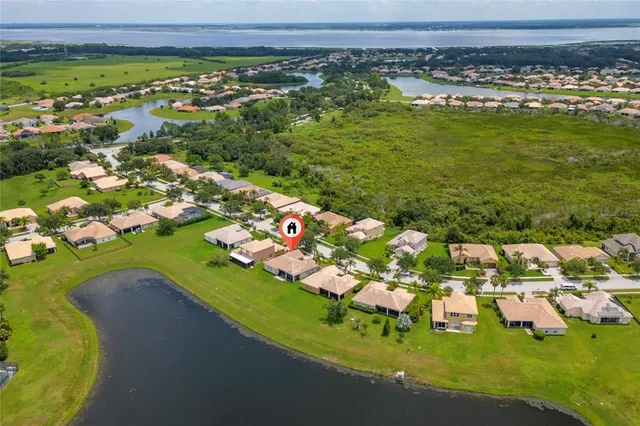 a view of a golf course with an ocean