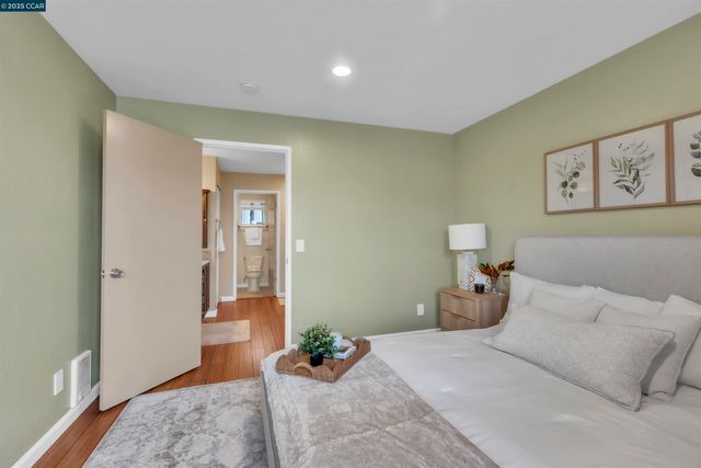 a bed room with a bed and a window