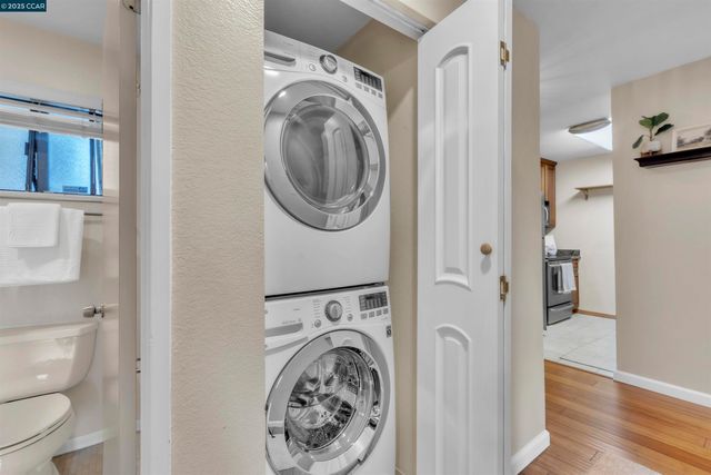 a view of a hallway with washer and dryer