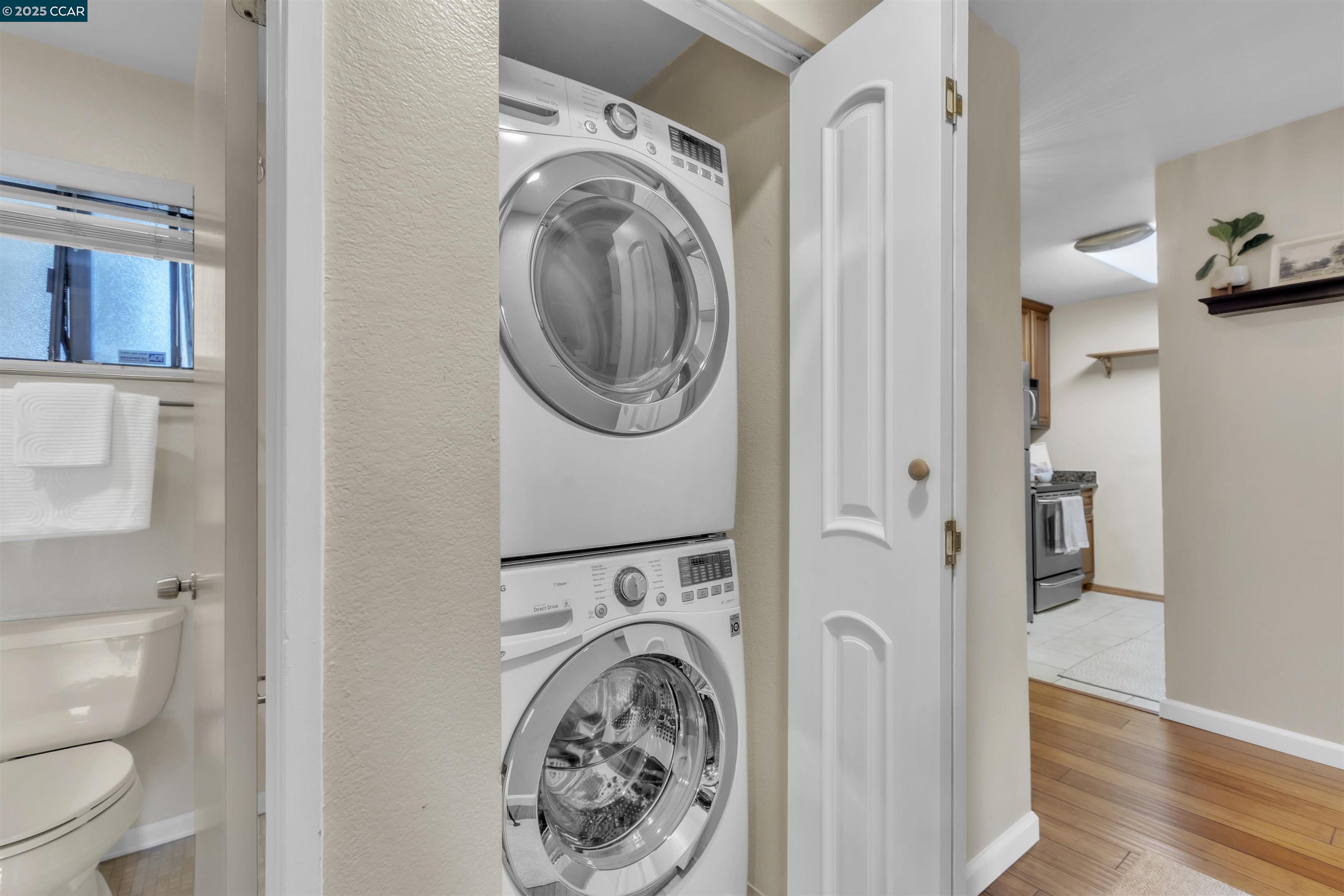 29583 Vanderbilt Street, Unit 310 Hayward, CA 94544 - Photo 14 of 22 a view of a hallway with washer and dryer