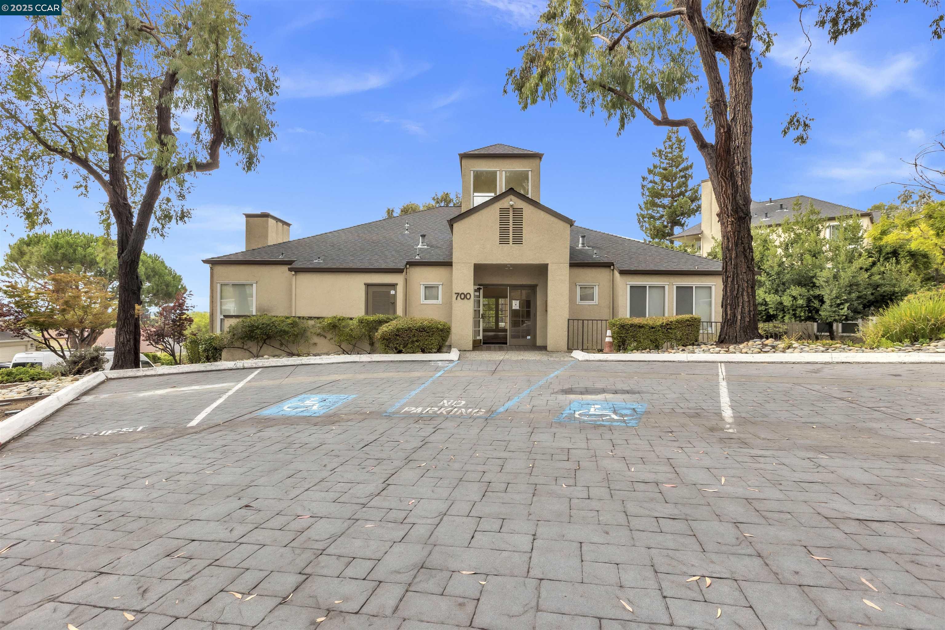 29583 Vanderbilt Street, Unit 310 Hayward, CA 94544 - Photo 17 of 22 a front view of a house with a yard and potted plants