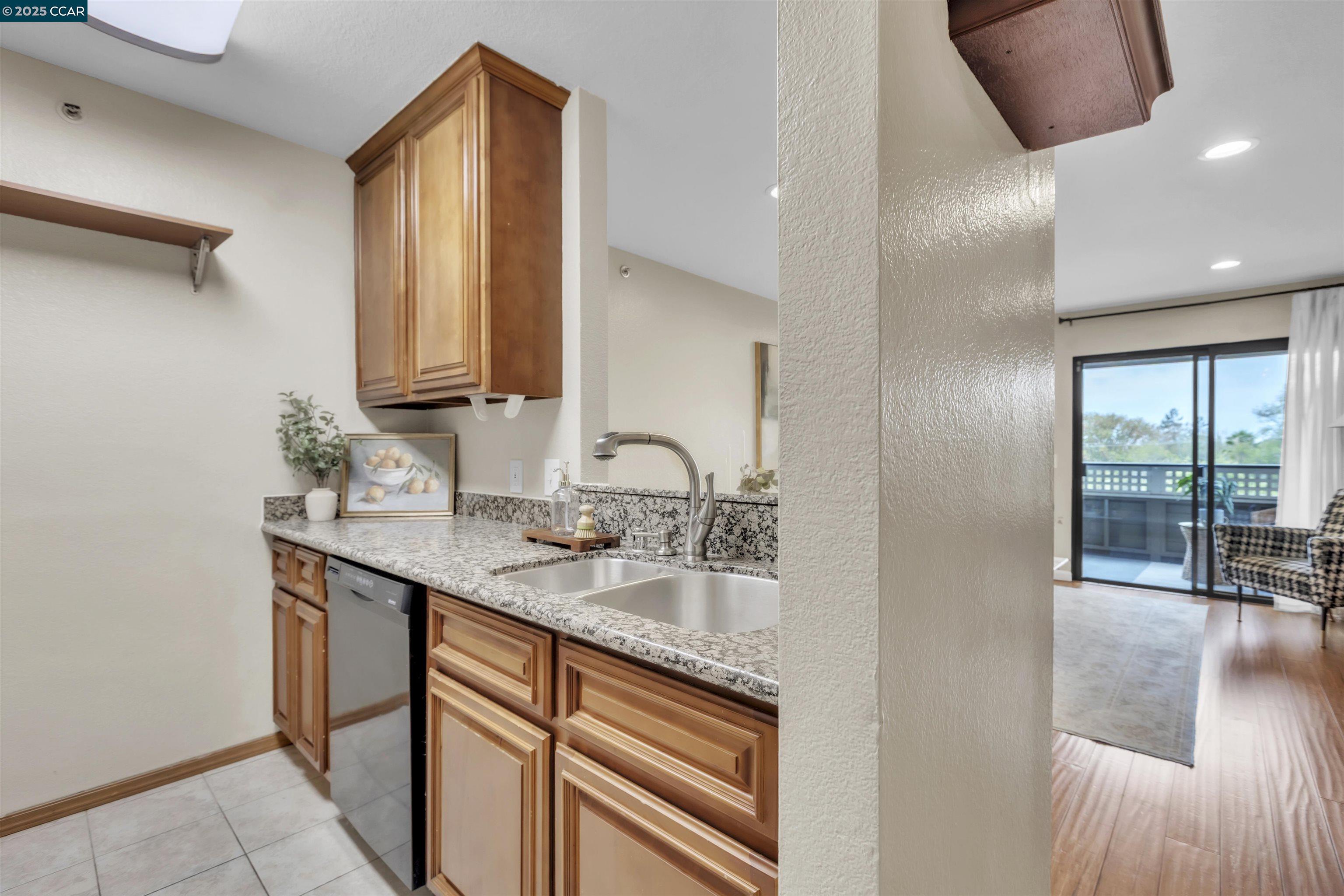 29583 Vanderbilt Street, Unit 310 Hayward, CA 94544 - Photo 2 of 22 a bathroom with a sink double vanity and a mirror
