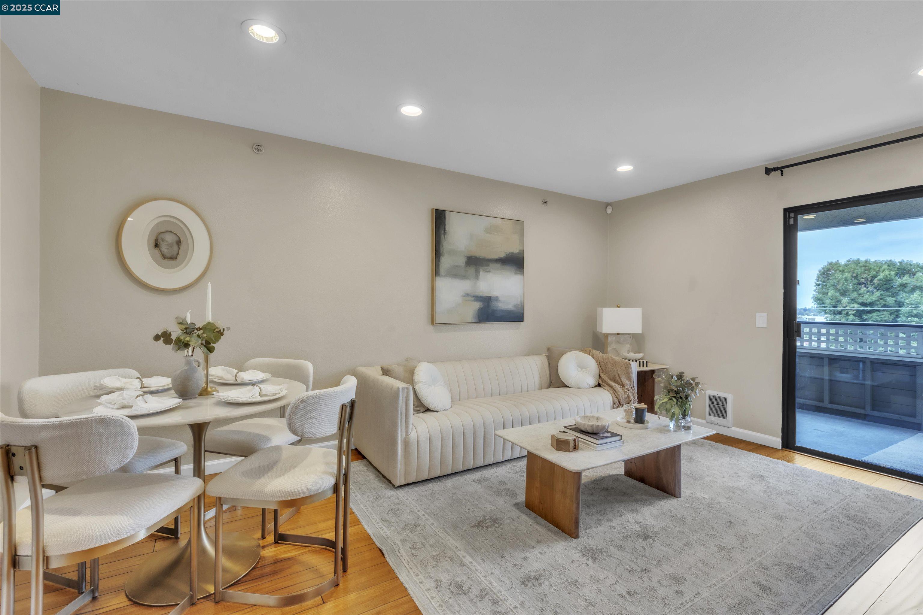 29583 Vanderbilt Street, Unit 310 Hayward, CA 94544 - Photo 7 of 22 a living room with furniture a window and a clock