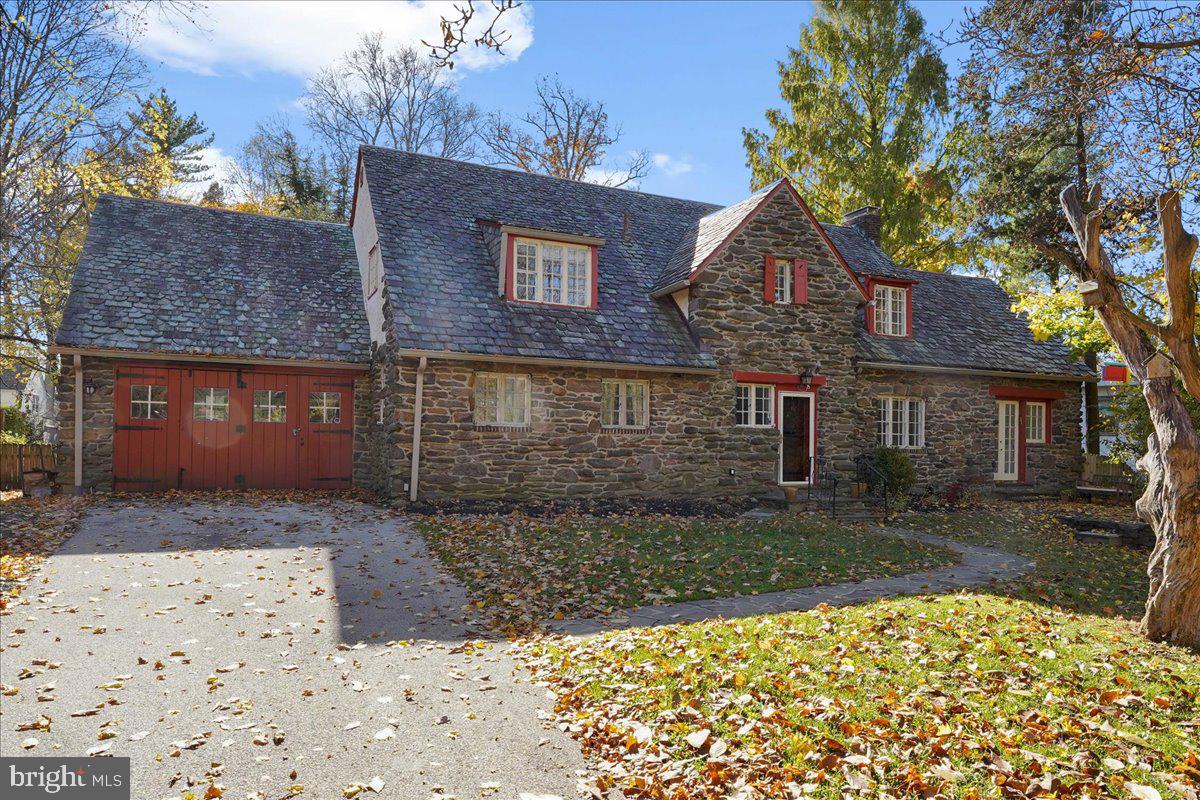 1222 West Wynnewood Road Wynnewood, PA 19096 - Photo 2 of 2 a front view of a house with a yard