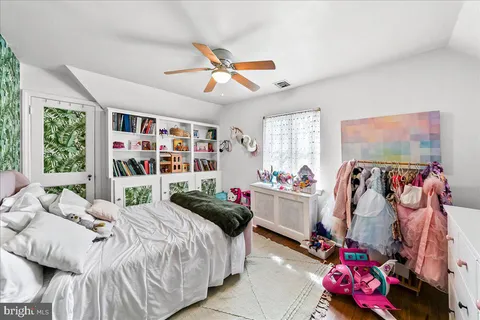 a bedroom with bed and a window