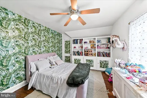 a bedroom with a bed furniture and decor
