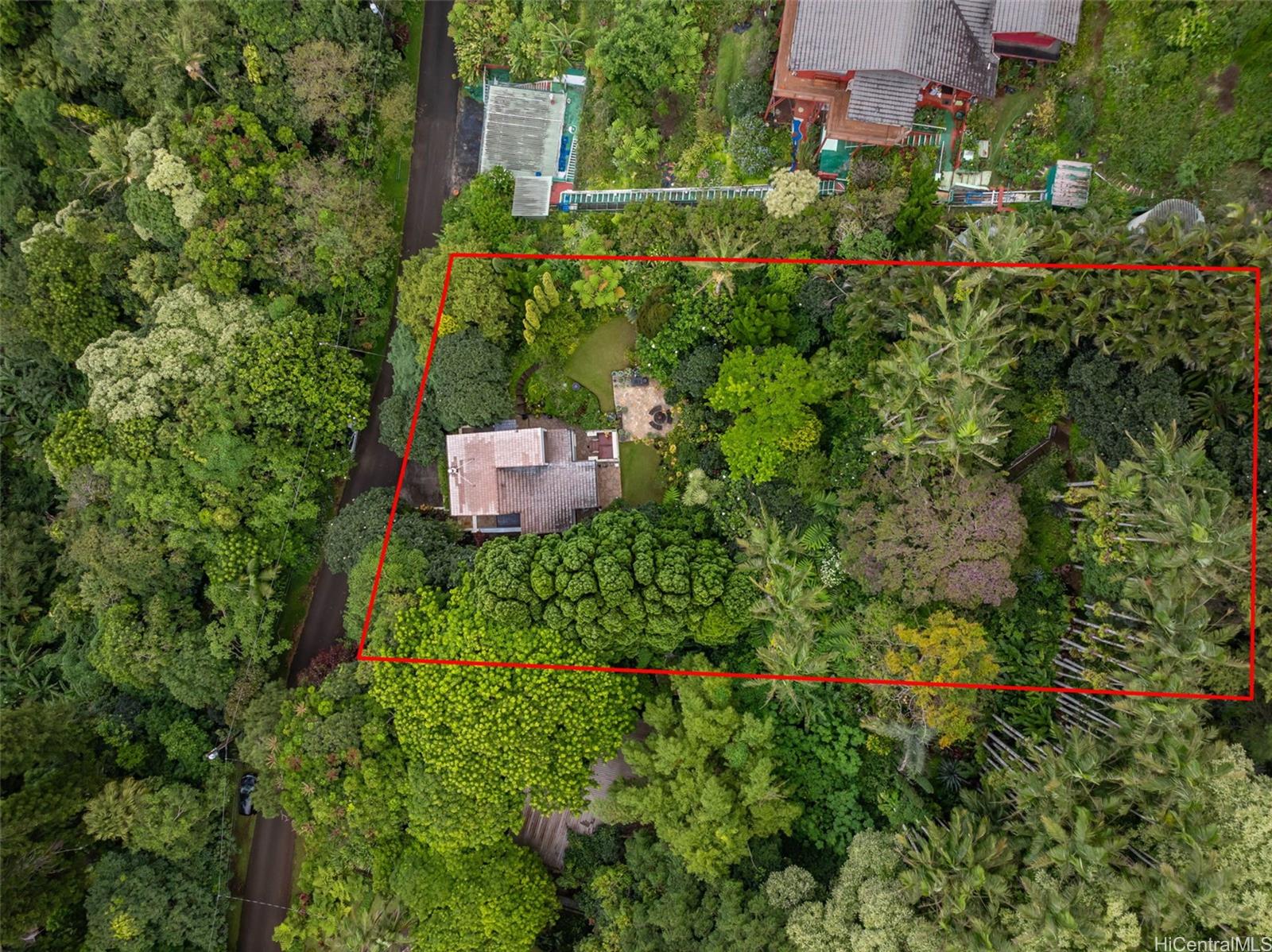 156 Forest Ridge Way Honolulu, HI 96822 - Photo 25 of 25 an aerial view of a house with a yard