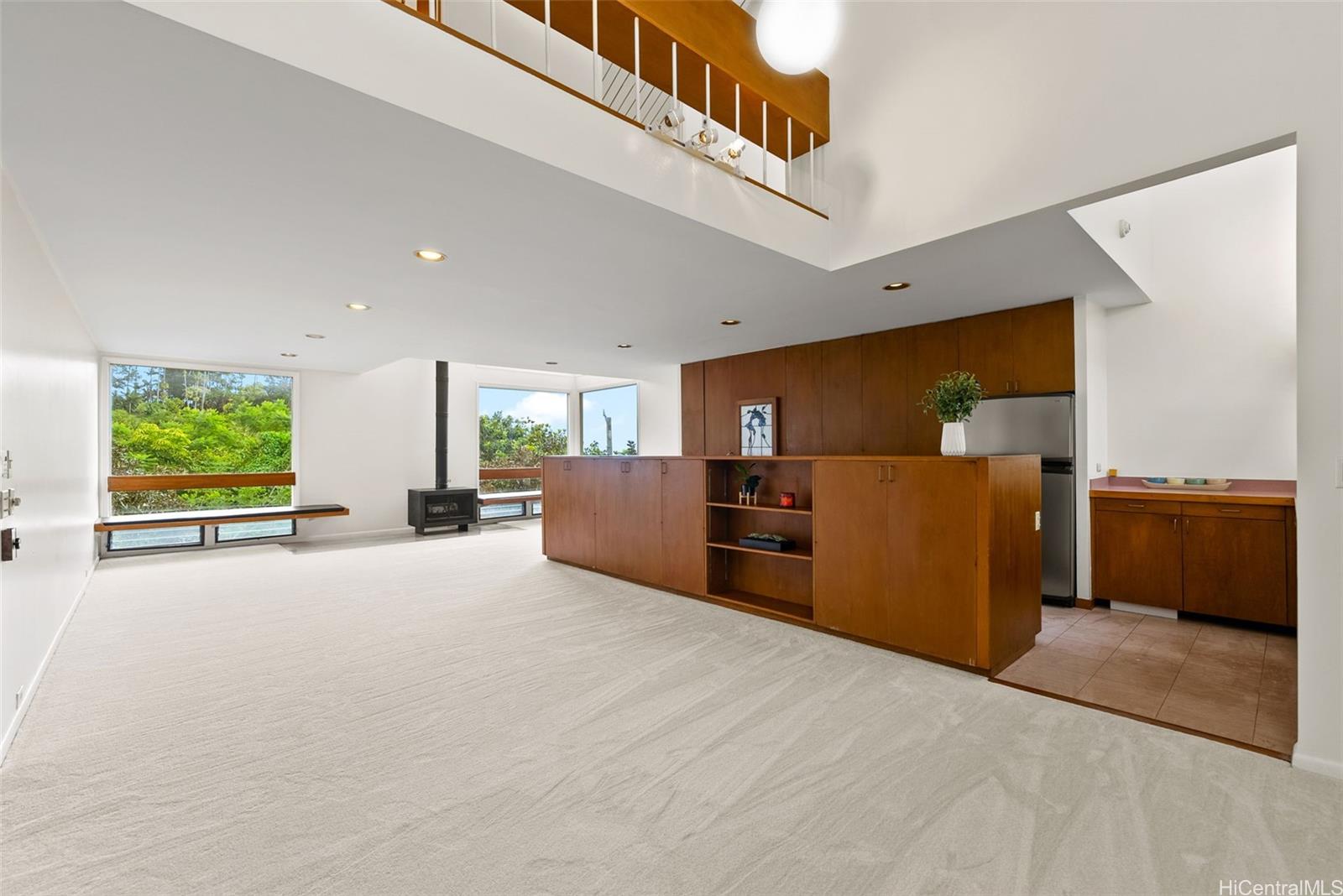 156 Forest Ridge Way Honolulu, HI 96822 - Photo 6 of 25 a view of a kitchen with furniture and a window