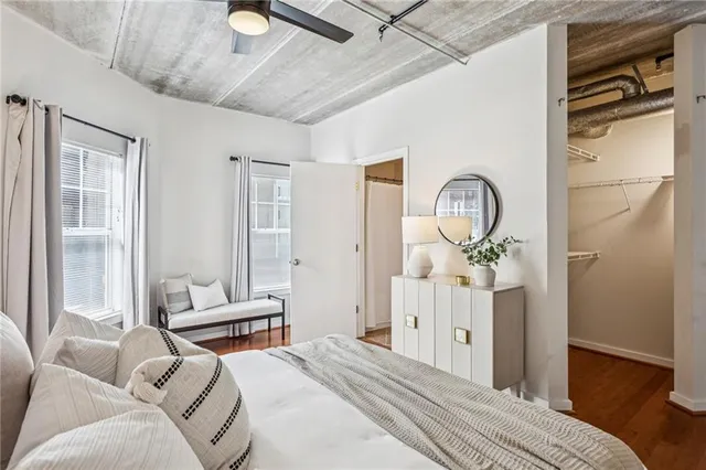 a bedroom with bed and a window