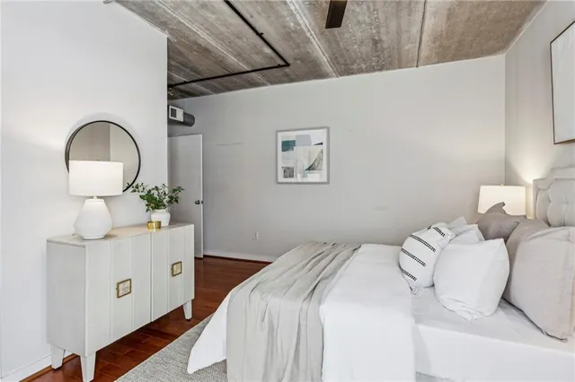 a bedroom with a bed and a dresser