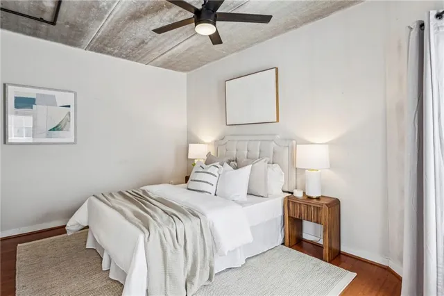 a bedroom with a bed and a lamp