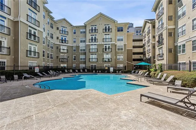 a front view of a building with outdoor seating